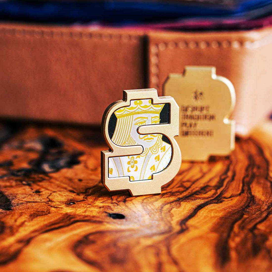 Golf accessories and side bet tools displayed on a wooden table