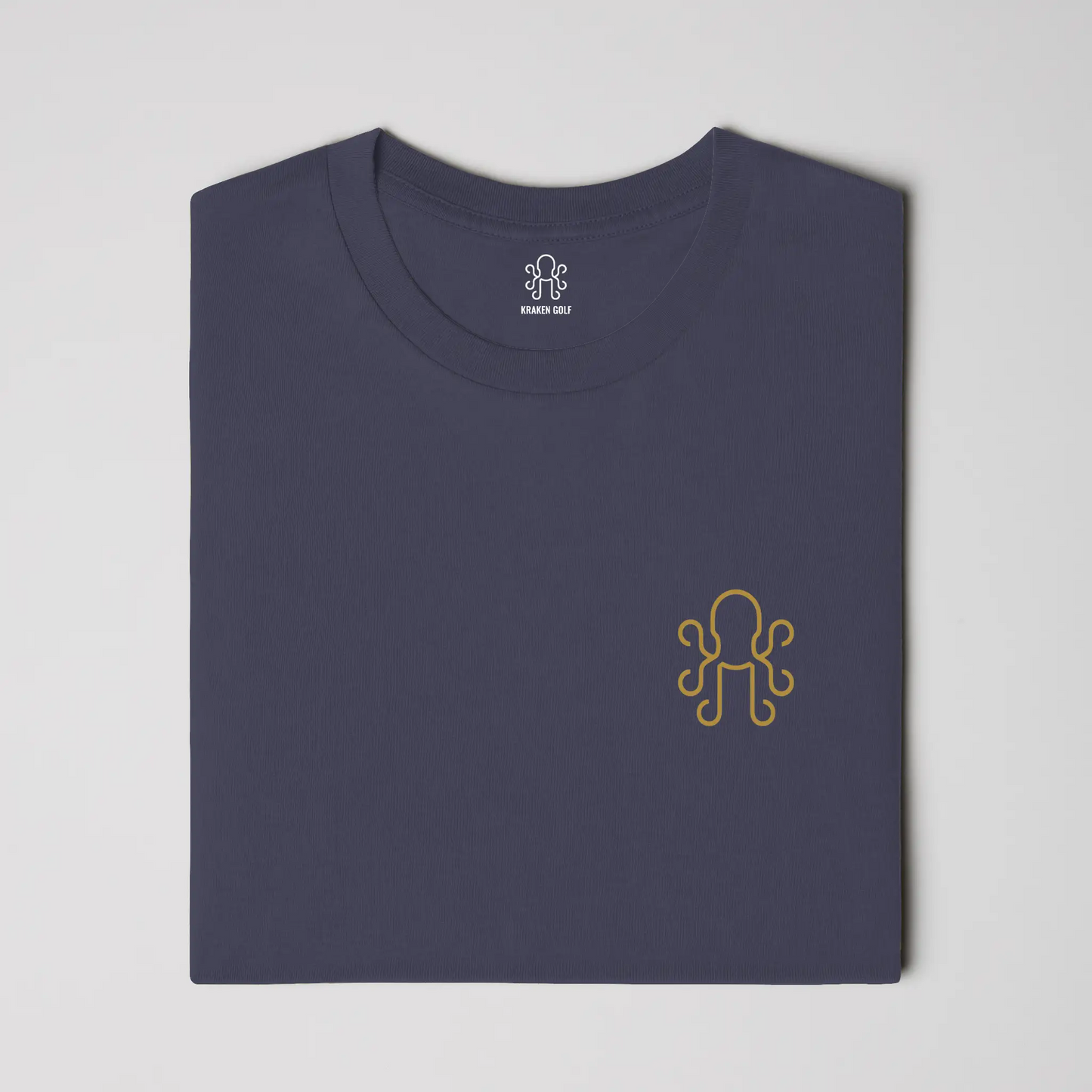 Navy heavyweight t-shirt on-model - relaxed fit front showing brass Kraken crest