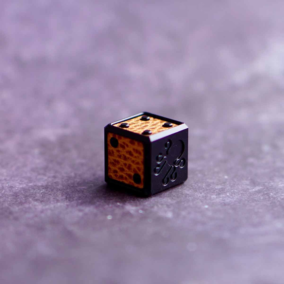 Stealth-style golf ball marker with luxury inlay and CNC-engraved branding