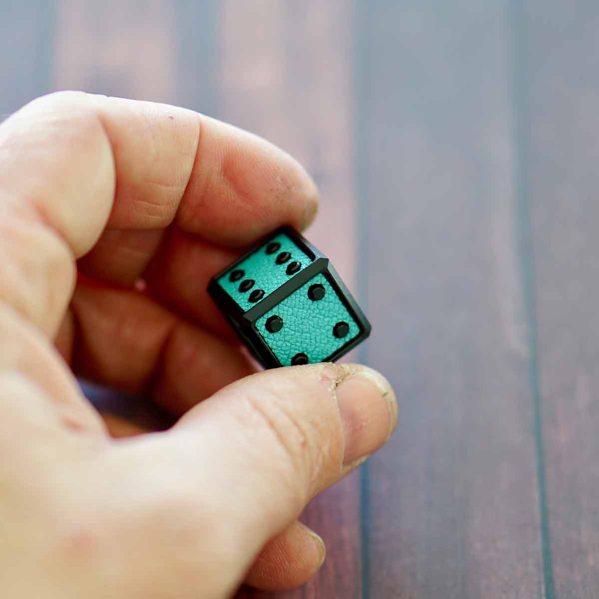Golf die tool milled from aircraft aluminum featuring Chèvre leather inlay