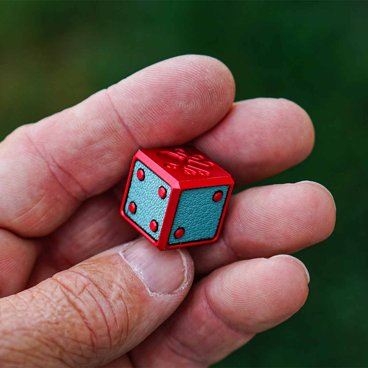 Kraken Golf Cotton Candy Die held in hand - luxury golf accessory with bold color