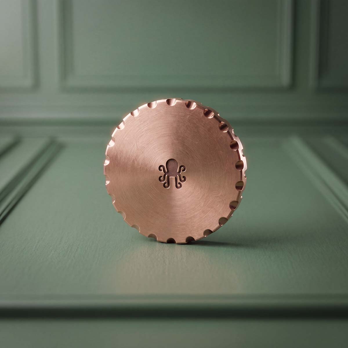Reverse of Hardhat copper golf ball marker showing centered laser-engraved Kraken Golf mark and scalloped EDC edge