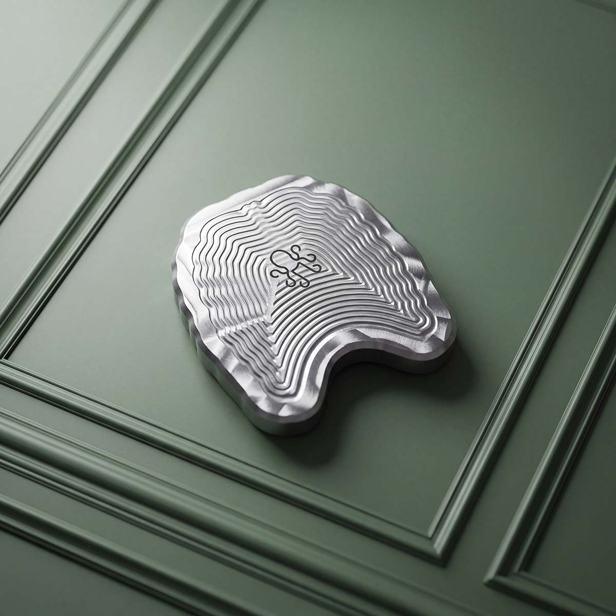 milled stainless steel rib cage ball marker showing welded ribs and natural CNC mill marks