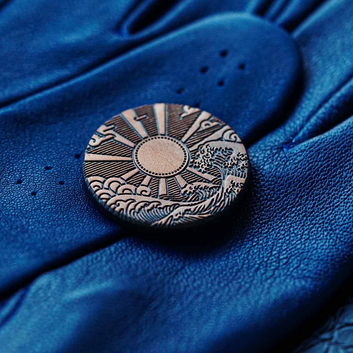 Kraken Golf copper ball marker engraved with Hinode rising sun motif