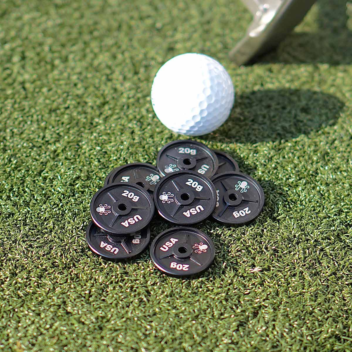 Weight plate golf ball marker – Kraken Golf strength meets swagger