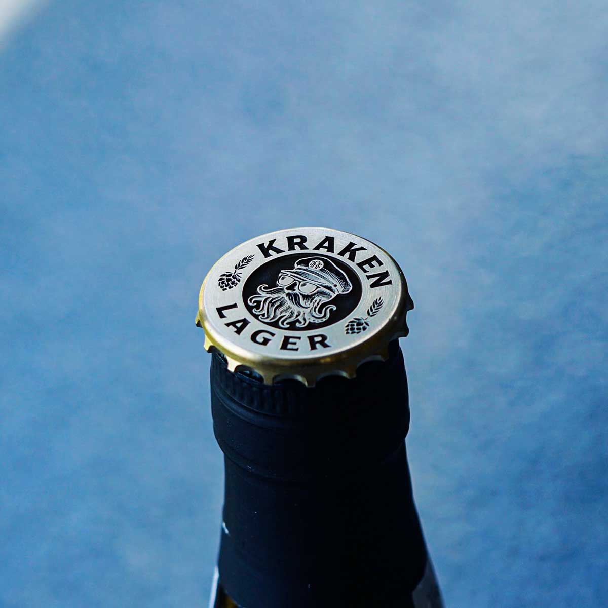 Closeup of skull in captain hat engraving with tentacle beard on brass marker