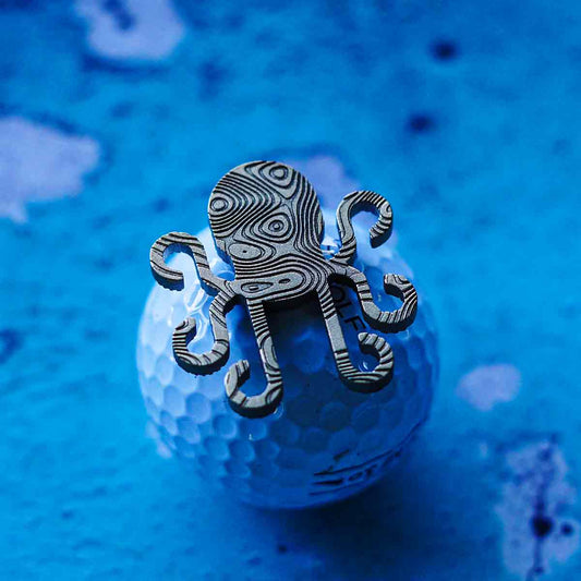 Kraken shaped golf ball marker in faux damascus brass