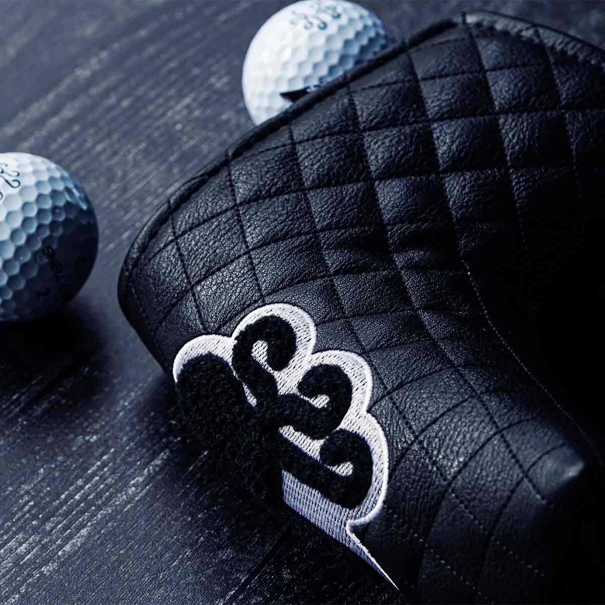 Black quilted blade putter cover with chenille Kraken logo and white embroidery - Midnight Collection by Kraken Golf