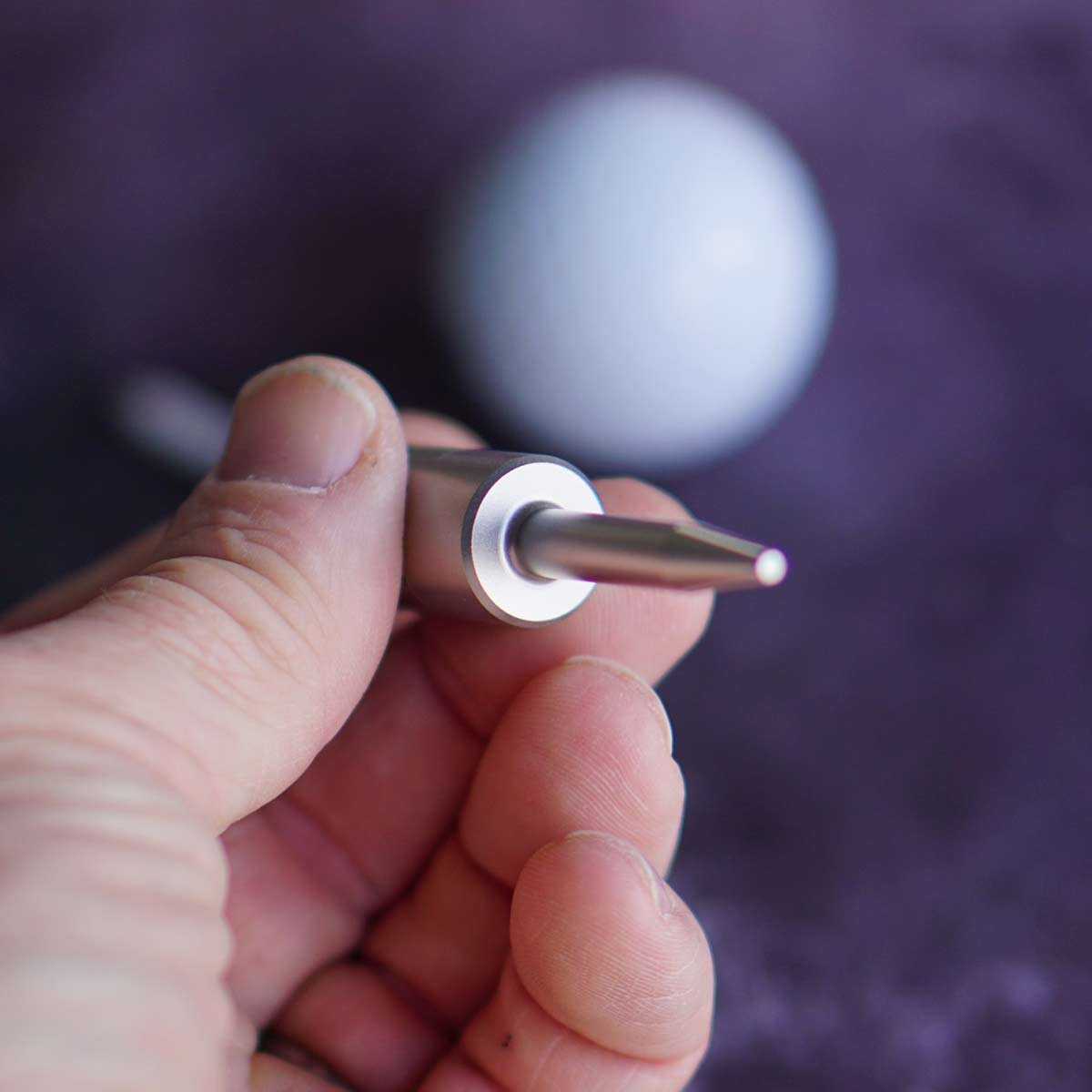 Close-up of stainless divot tool forged from solid 303 stainless steel