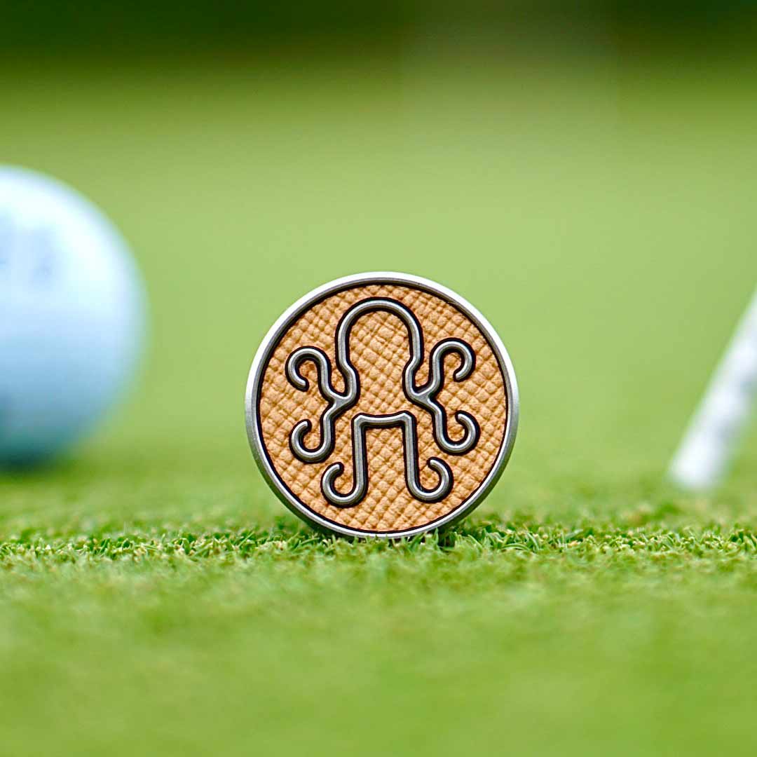 Stainless steel Autobahn ball marker featuring a sleek Italian leather inlay, blending precision engineering with luxury craftsmanship.