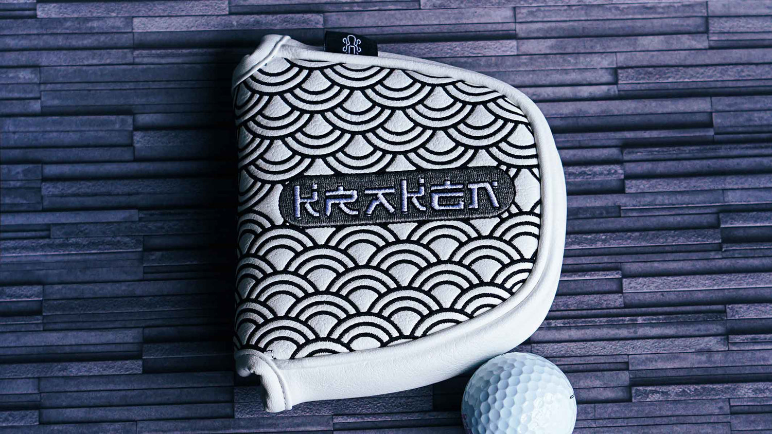 Kraken Golf White mallet cover with silver and black Japanese waves an script. 