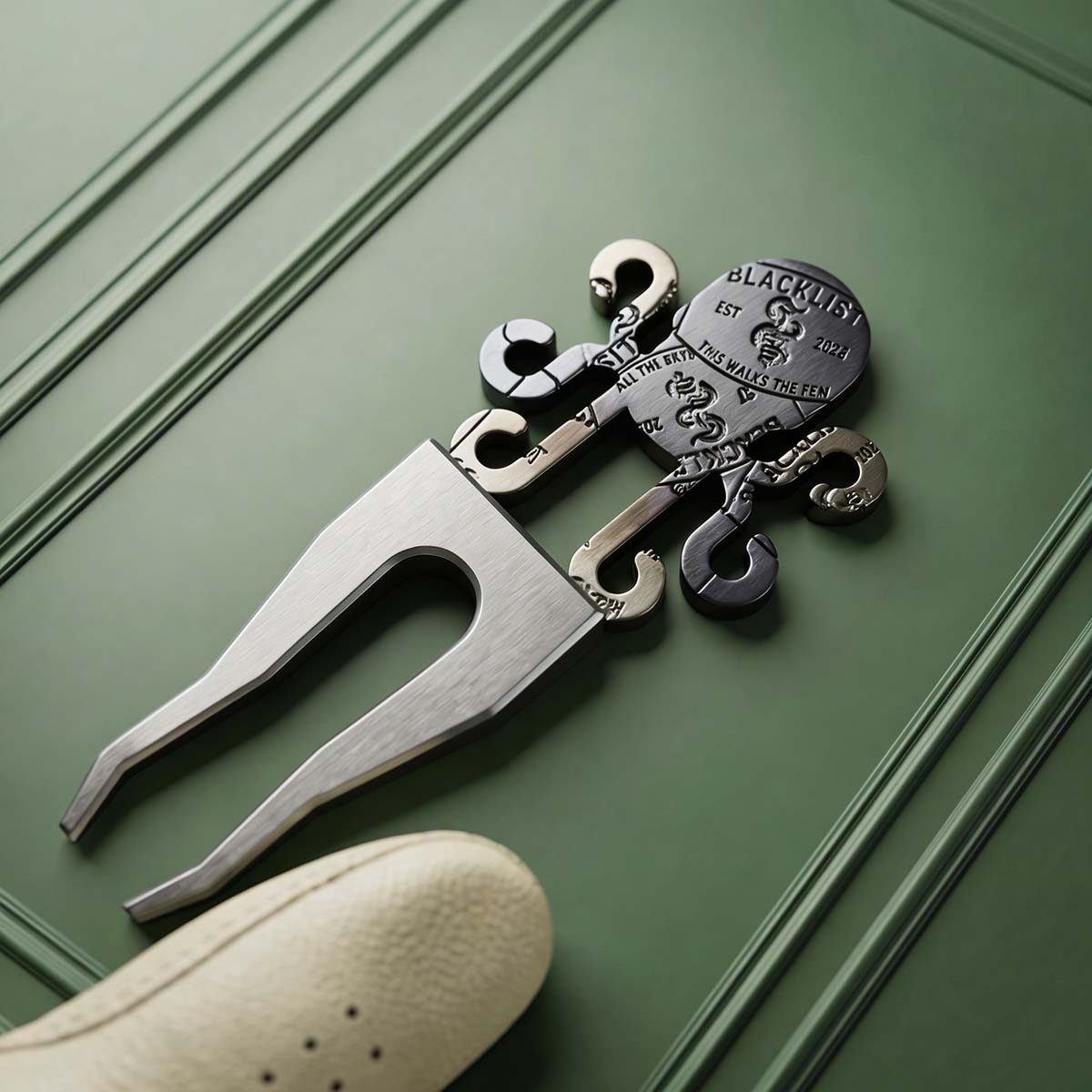 Back side of Blacklist 024 Blue Flame Kraken Pitch Tool showing engraved detailing and torched stainless finish