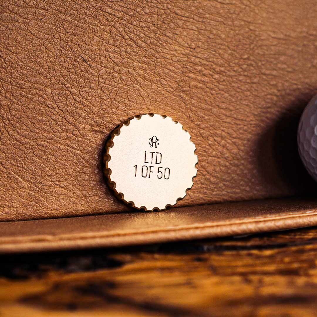 Back side of Lord of Latvertia golf ball marker with engraved Kraken Golf insignia and individual limited edition numbering out of 50
