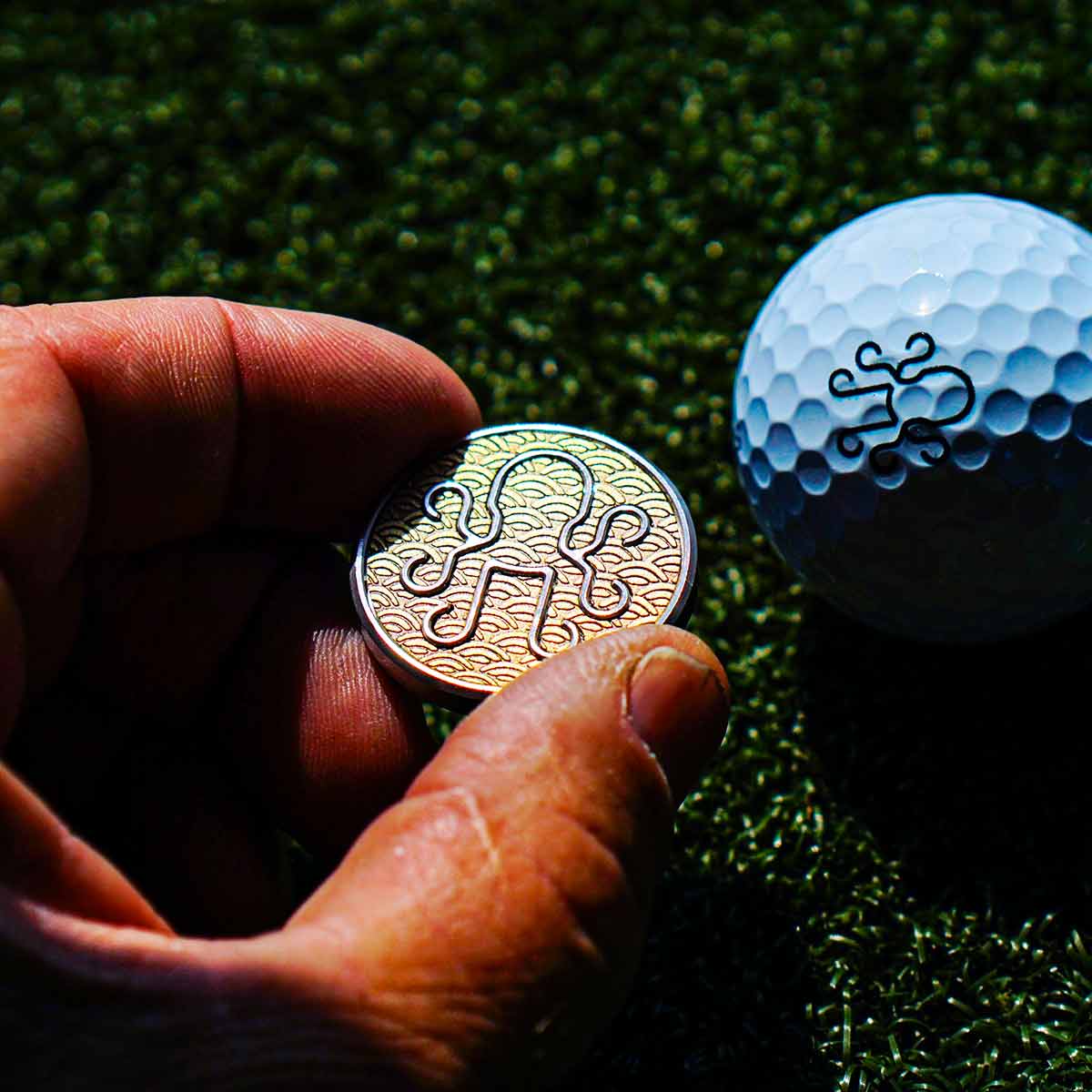 Shinkai ball marker front with etched brass Japanese Seigaiha wave inlay on stainless steel body