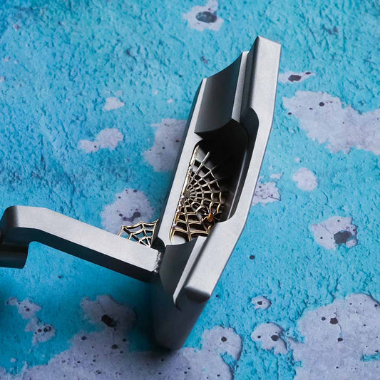 Arachne limited edition 303 stainless steel golf putter with welded spider web cavity details and satin polished face by Kraken Golf