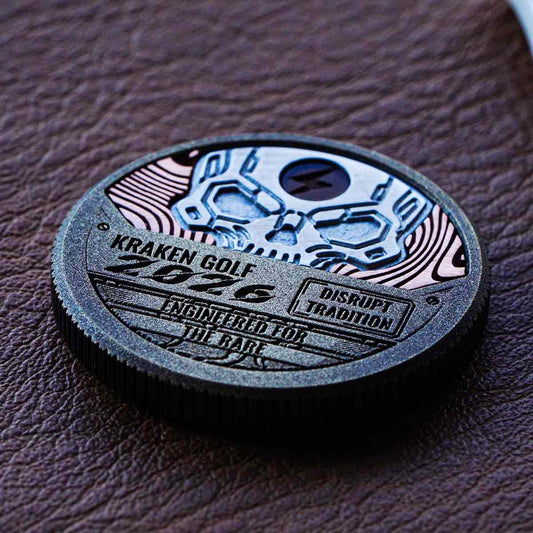 Arc Revenant ball marker with copper Damascus inlay and aluminum skull with lightning enamel.