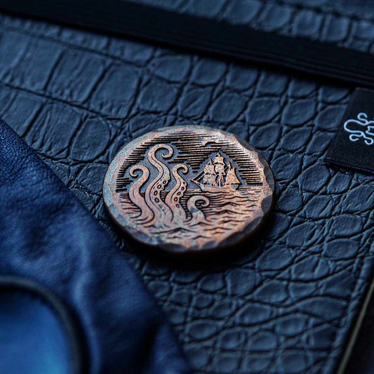 Kraken Golf The Awakening copper ball marker with engraved Kraken and ship design