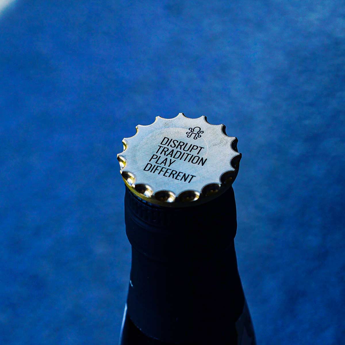 Back engraving Disrupt Tradition Play Different on brass golf ball marker