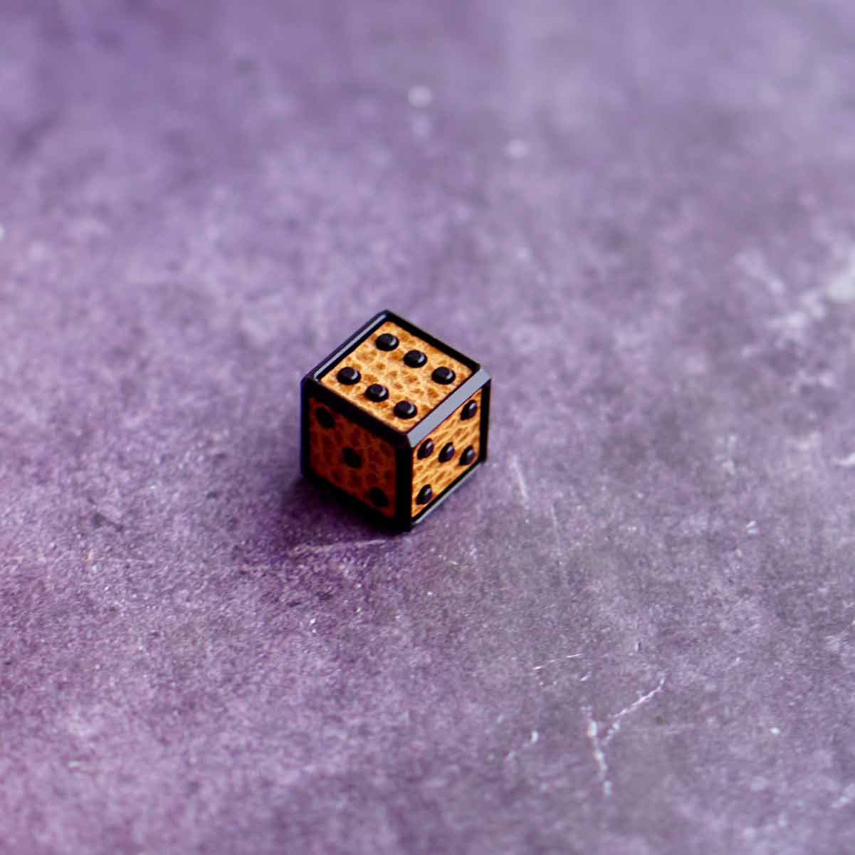 Kraken Golf black dice marker with deep leather contrast in camel tone