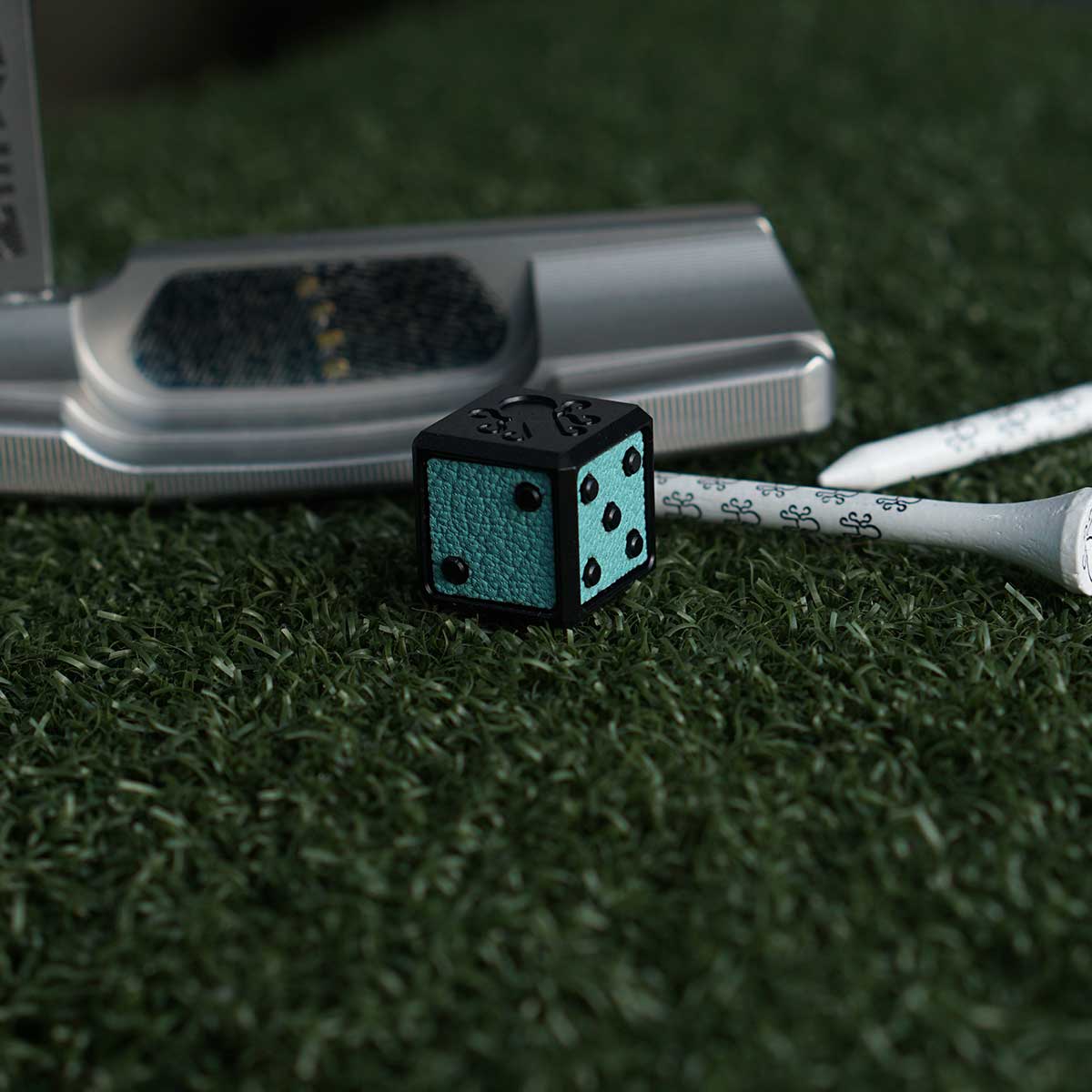 Black anodized aluminum cube golf marker with Tiffany Blue leather inlays

