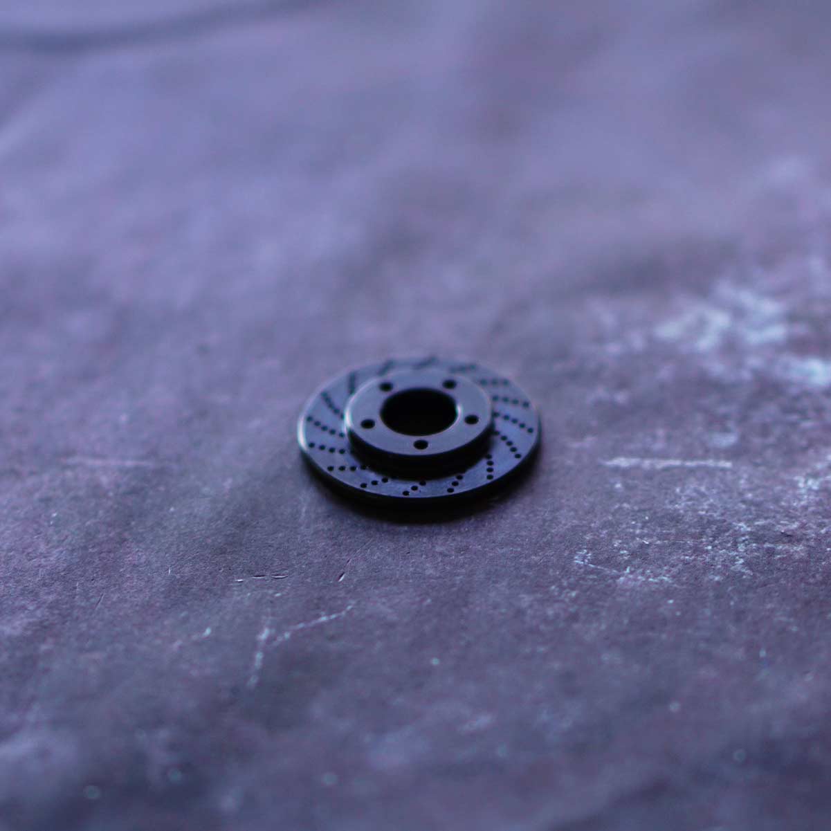 Kraken Golf carbon steel ball marker shaped like a rotor