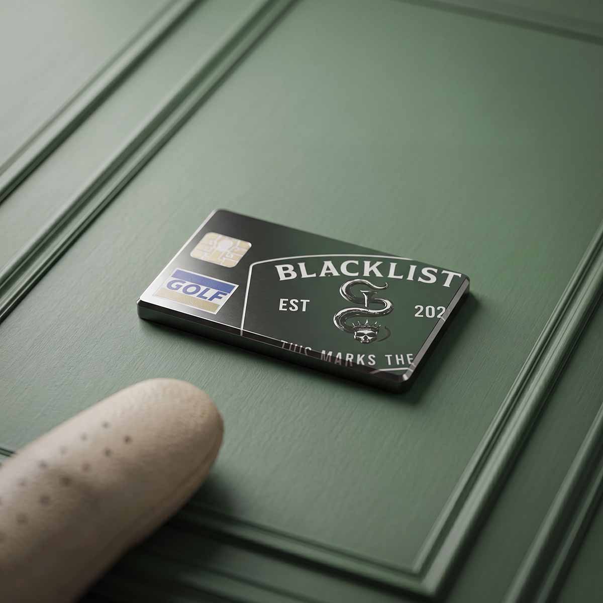 Blackened front of the Blacklist Black Card golf ball marker with BLACKLIST wordmark, Kraken sigil chip, and GOLF mark