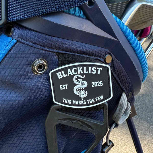 Seal of the Few Blacklist golf patch - Skully with tee through head and tentacle on a golf bag
