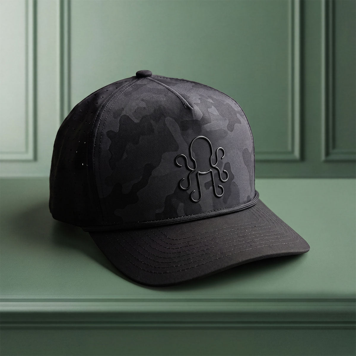 Blackout golf hat by Kraken Golf, black tonal camo with debossed octopus logo