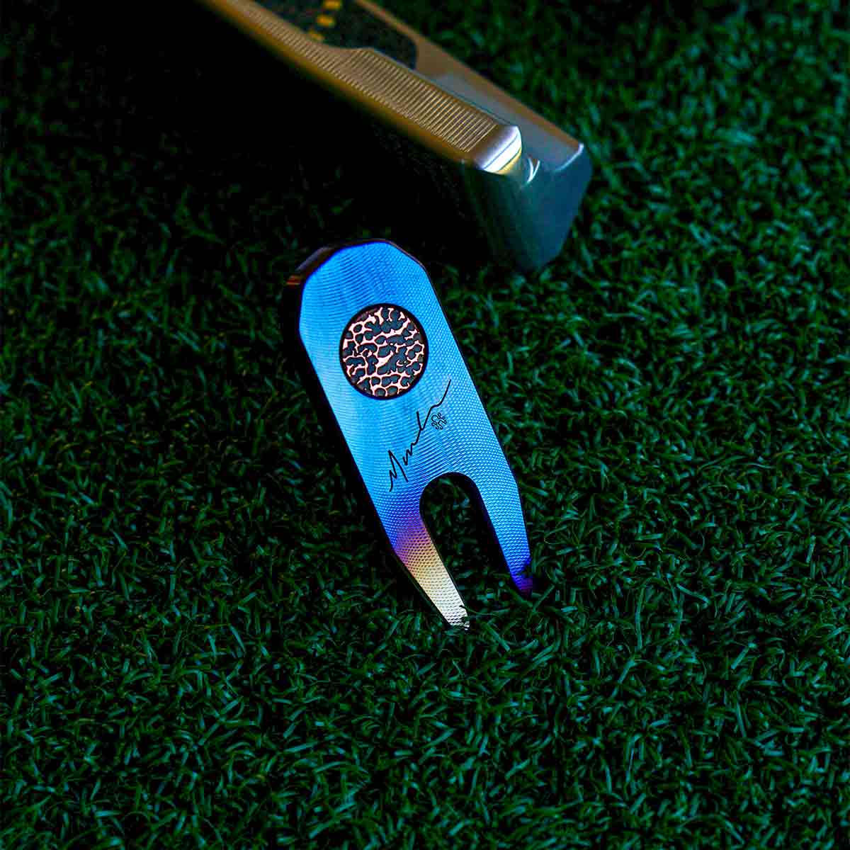 Torched blue carbon steel golf accessory - copper inlay detail