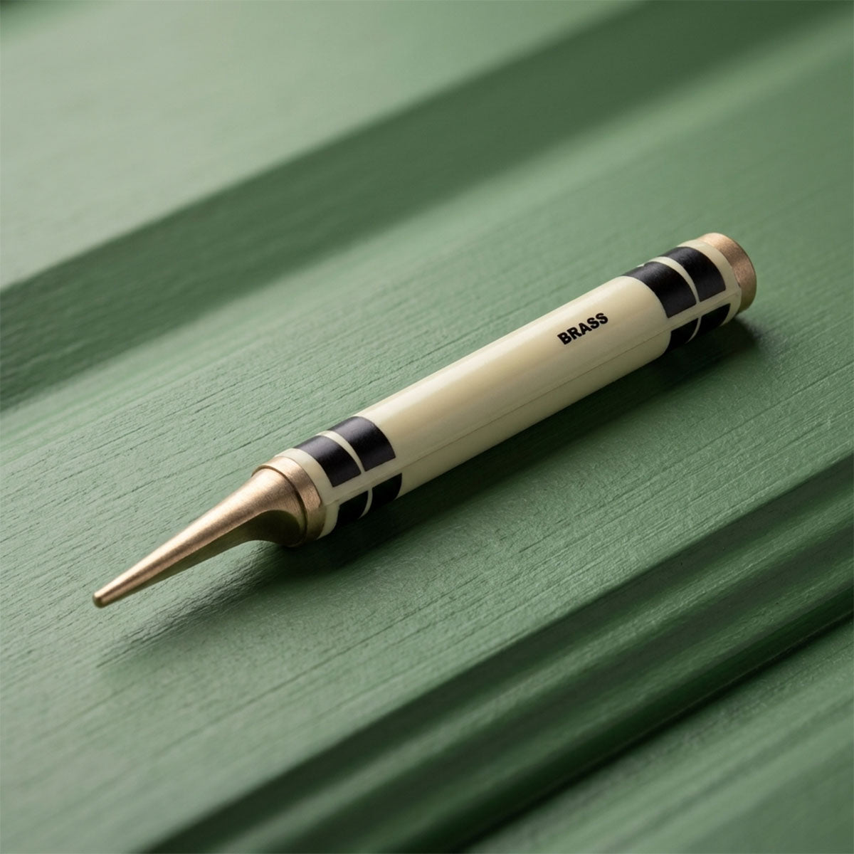Kraken Brass Crayon Pitch tool on a green background
