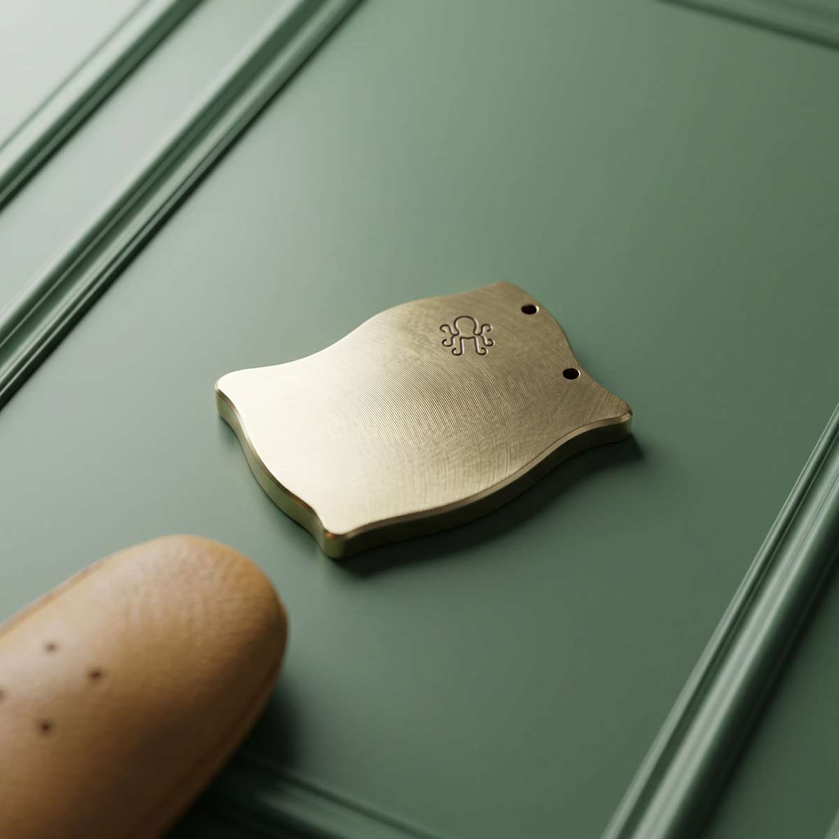 Back of brass pirate flag marker with Kraken Golf logo engraving