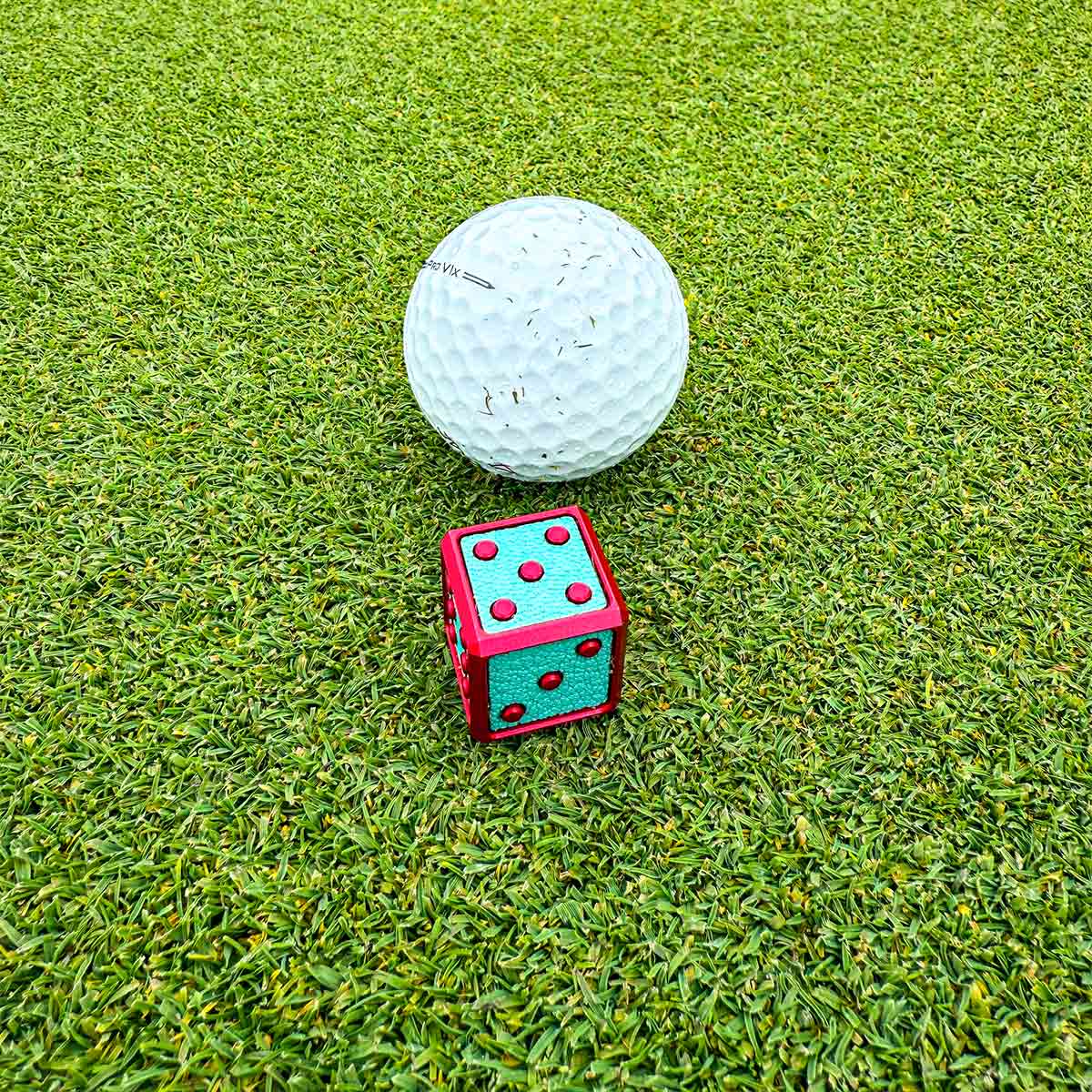 Overhead view of Cotton Candy Die showing leather inlays and satin pink finish