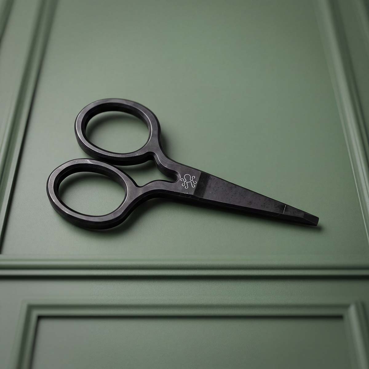 CUT LINE black oxide carbon steel scissor pitch tool with small Kraken logo laser-marked to bare steel