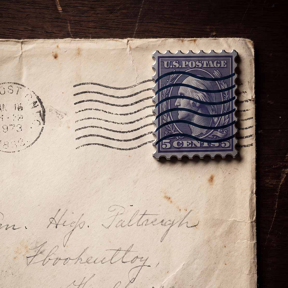 Face Value Golf Ball Marker on a letter
