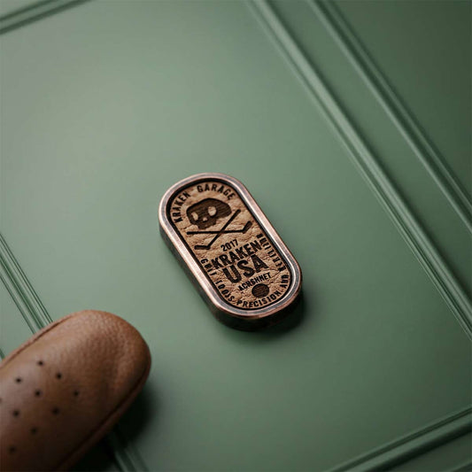 Copper Pillar golf ball marker on green background with leather inlay