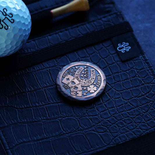 Kraken Golf Hobo Luck copper ball marker with engraved design and patina finish