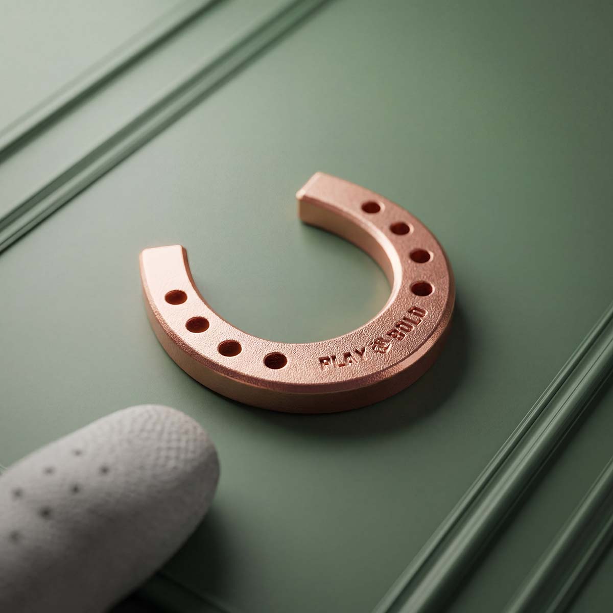 Reverse of Kraken Golf Lucky Horseshoe copper golf ball marker featuring engraved Kraken seal — limited edition DTC golf accessory