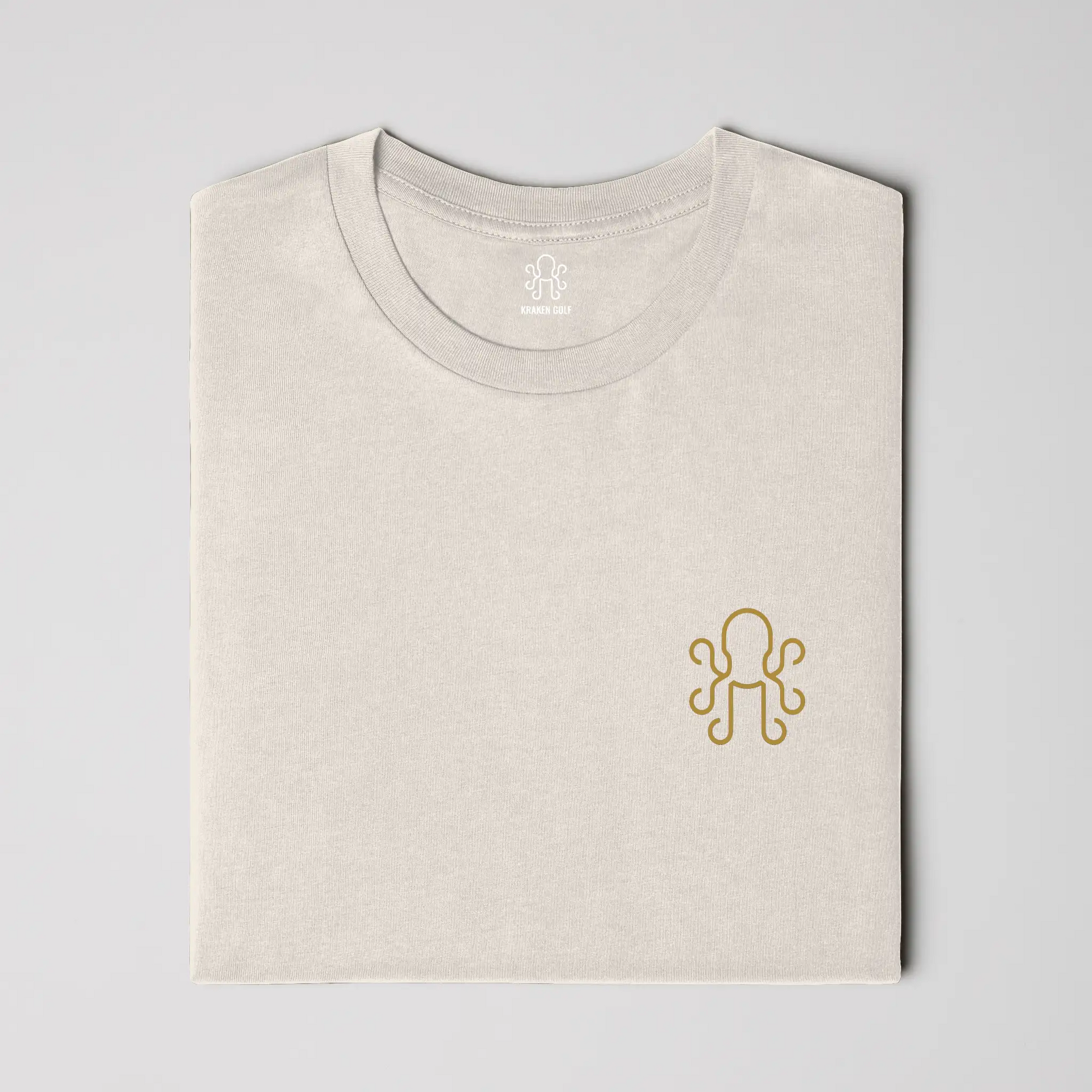 Ivory heavyweight t-shirt on-model - relaxed fit front showing brass Kraken crest