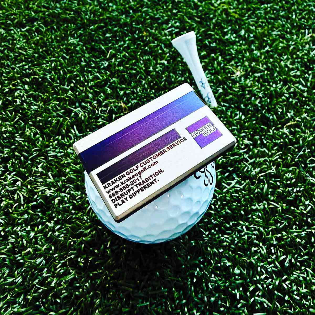 Credit card style golf ball marker made from Grade 5 titanium with koi design