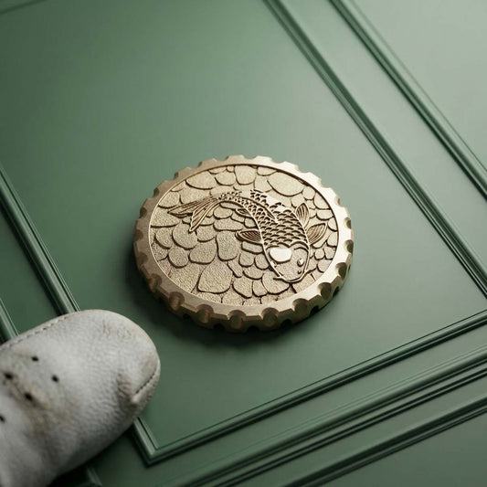 Koi 2.0 brass golf ball marker with two-level engraved koi design