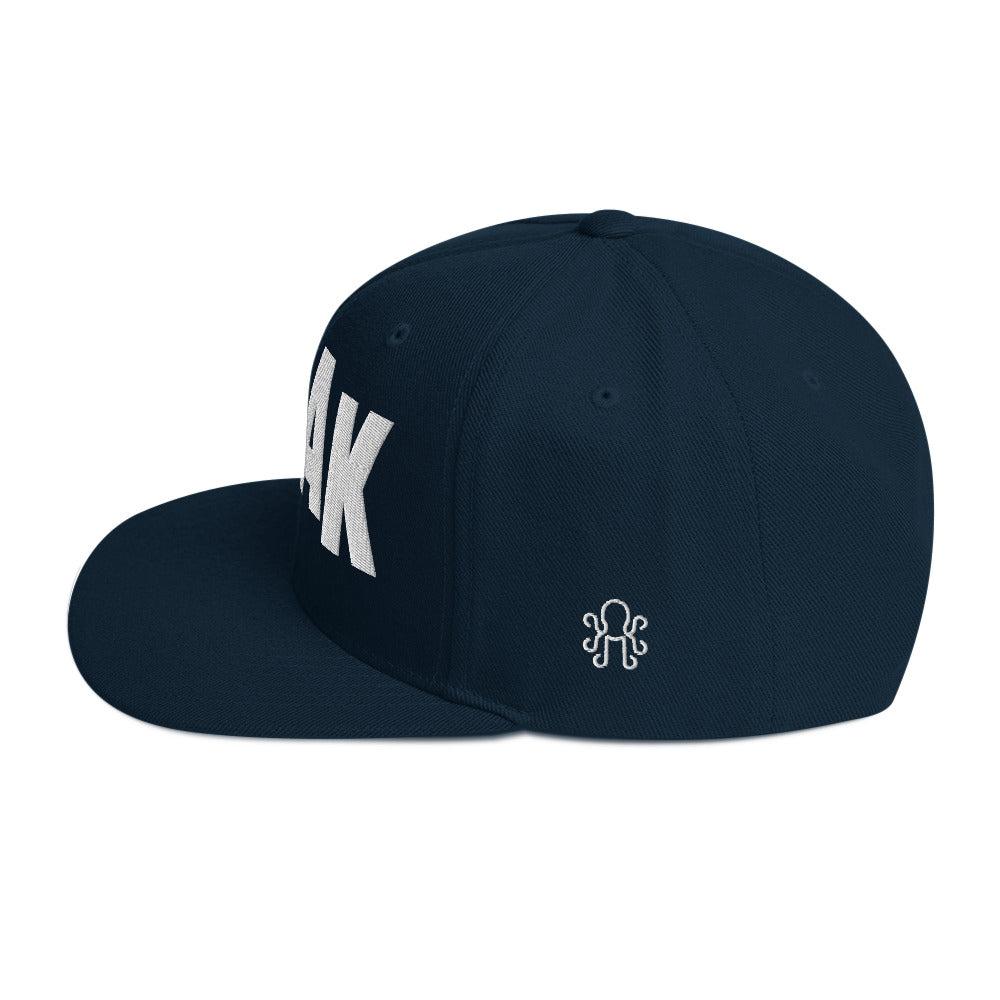 Hollywood-style white text on navy Kraken Golf snapback