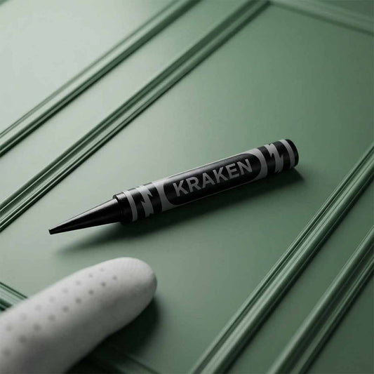 Black crayon golf pitch tool on green background