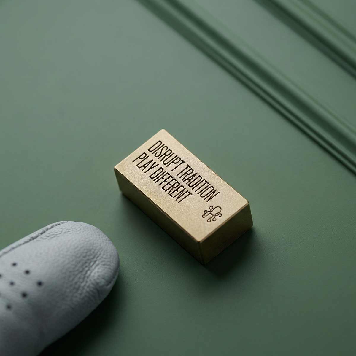 Kraken Brix ball marker with text DISRUPT TRADITION PLAY DIFFERENT