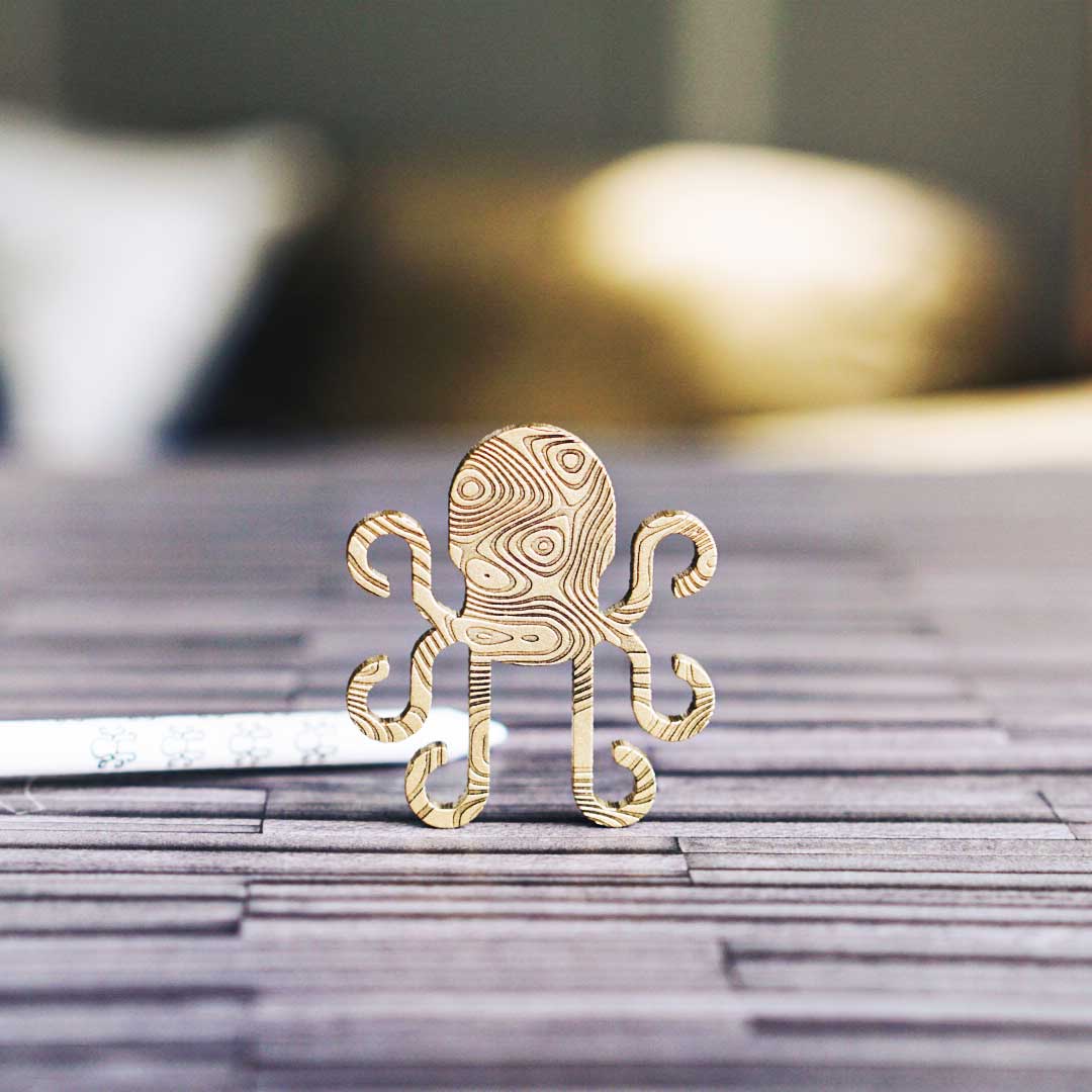 Kraken brass Damascus golf ball marker with etched wave pattern