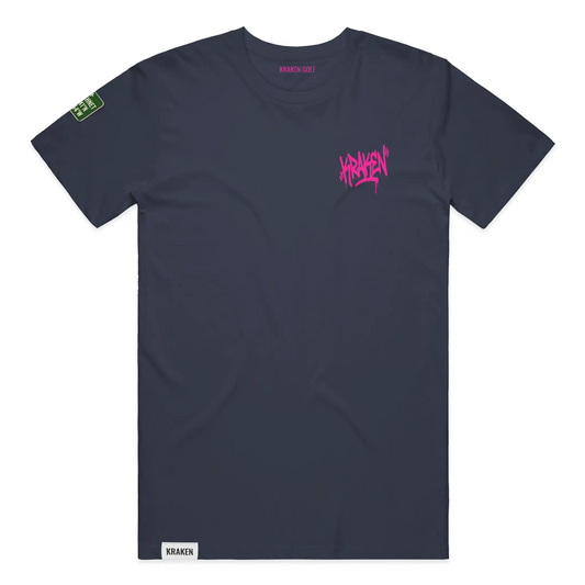 Left chest detail of the navy Origin tee showing the black Kraken graffiti tag on heavyweight garment-dyed cotton