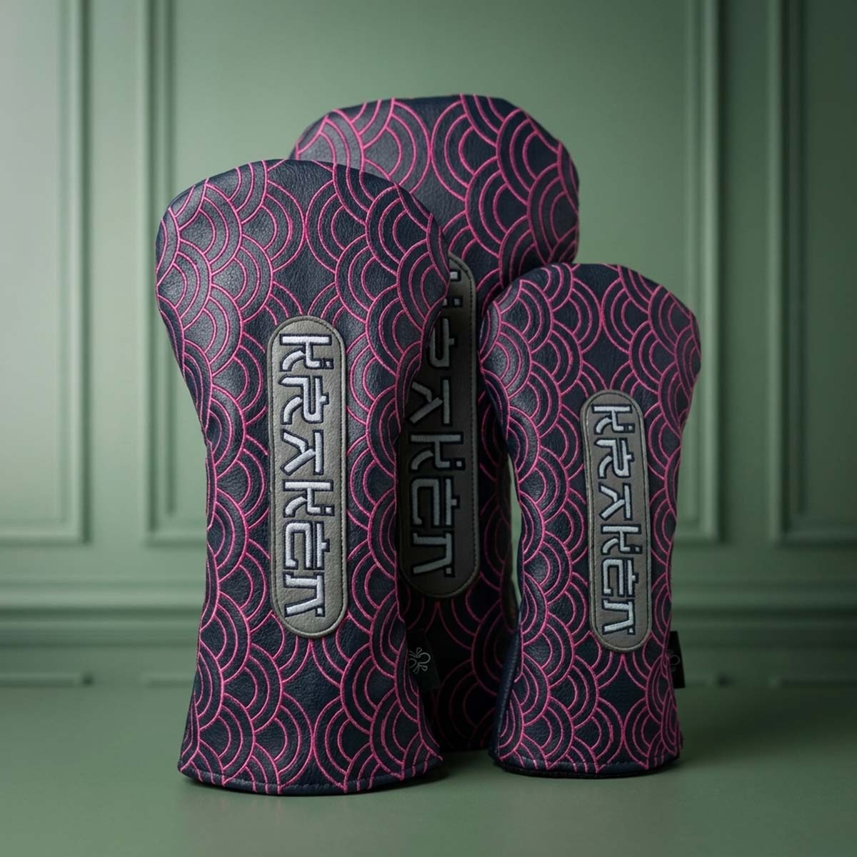 Navy driver, fairway, and hybrid headcovers with hot pink embroidered Japanese wave pattern and vertical silver KRAKEN badges