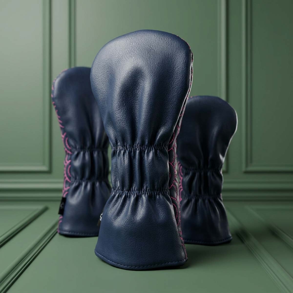 Back view of navy Seigaiha 3-piece golf wood headcover set showing clean panels and elastic necks with pink wave edges, Kraken Golf