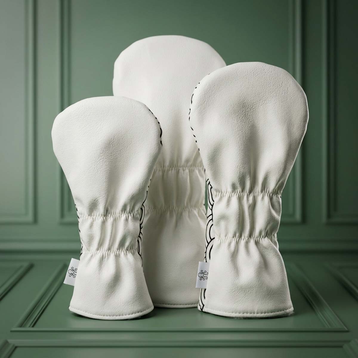 Back view of white Seigaiha 3-piece golf wood headcover set showing clean ivory panels and elastic necks, Kraken Golf