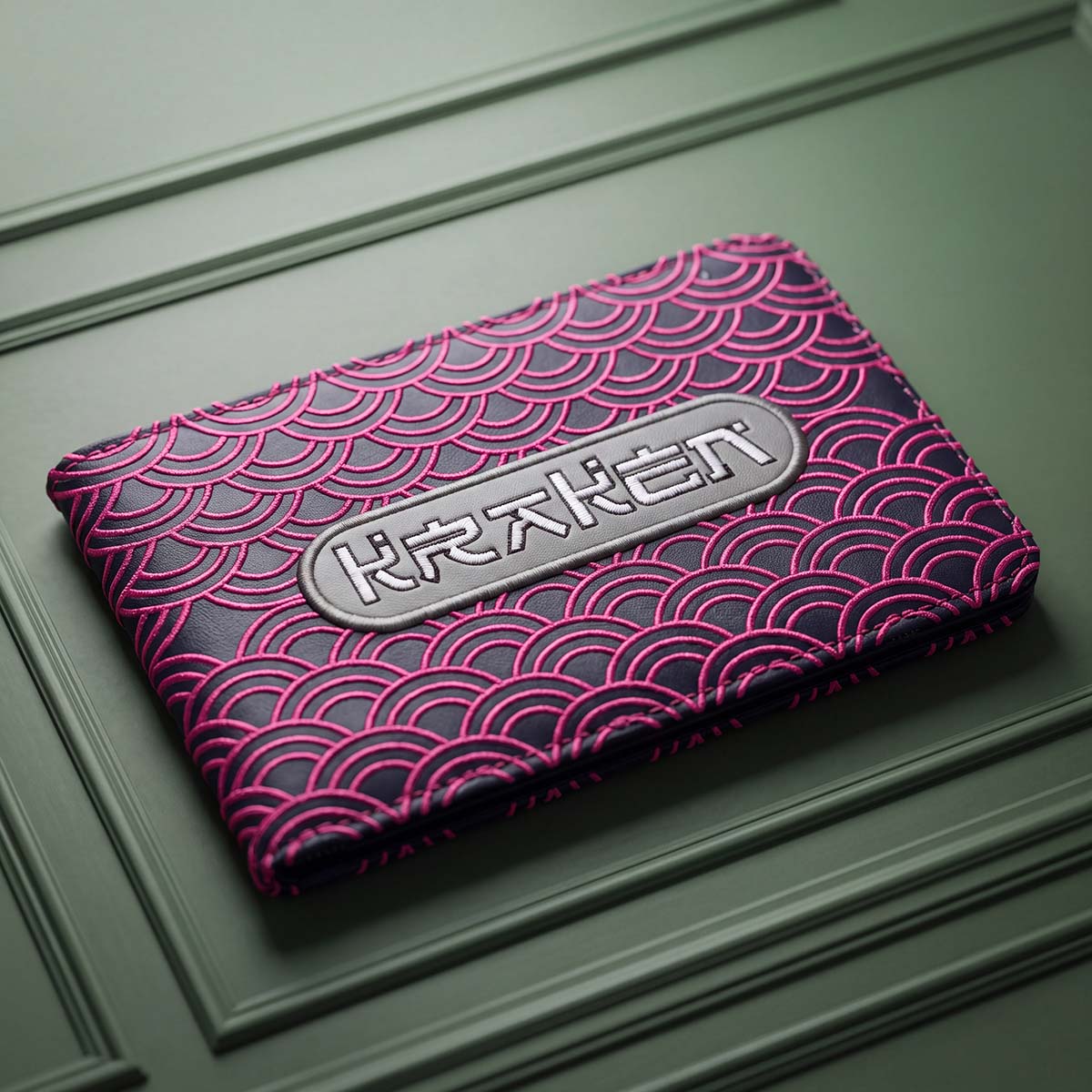 Navy Seigaiha yardage book holder with hot pink embroidered Japanese wave pattern and silver KRAKEN badge, Kraken Golf