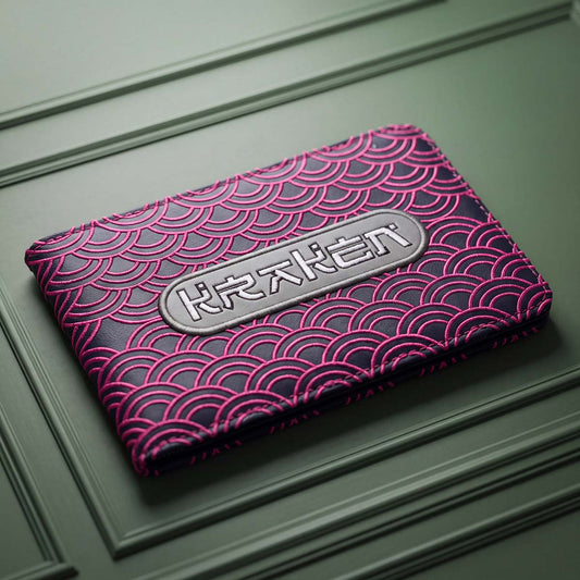 Navy Seigaiha yardage book holder with hot pink embroidered Japanese wave pattern and silver KRAKEN badge, Kraken Golf
